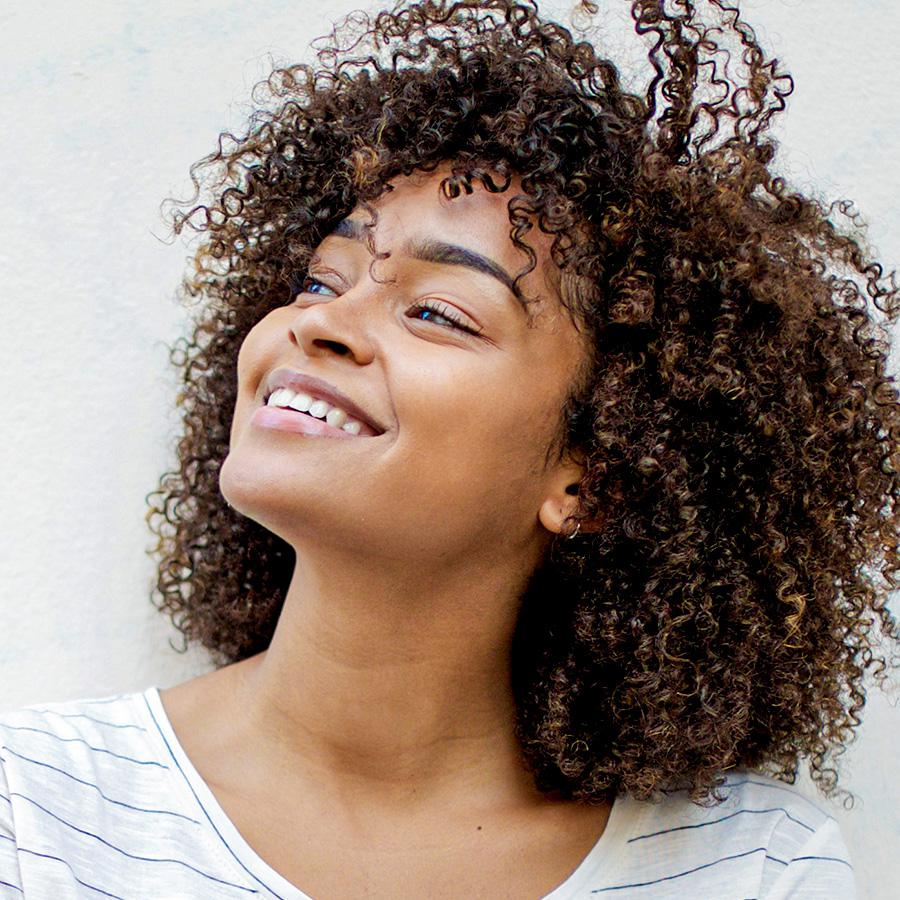 woman with pretty smile from adult orthodontics and braces